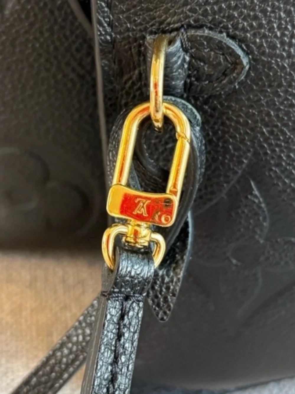 Louis Vuitton Black Embossed Monogram never fall MM with Pouch